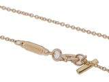 a close up of a gold chain with a cross on it