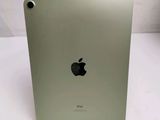 an apple ipad is sitting on top of a white table