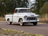 a white truck that is driving down the road