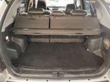 a trunk of a car with a table in the back