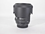 a close up of a camera lens on a white surface