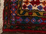 a cat that is laying on a rug on the floor