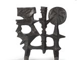 an image of a metal sculpture of a man and a woman