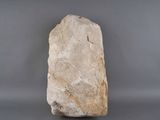 an image of a large rock on a gray surface