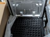 a box that has a waffle maker inside of it