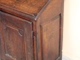 a wooden desk with a wooden top in a room