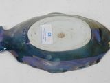 a blue and purple fish shaped bowl on a white surface