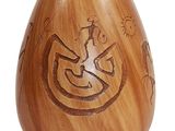 a wooden vase that has a design on it
