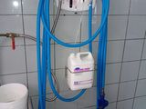 a large blue hose attached to a wall next to a sink
