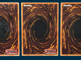 three cards with a picture of a black hole in the middle of them