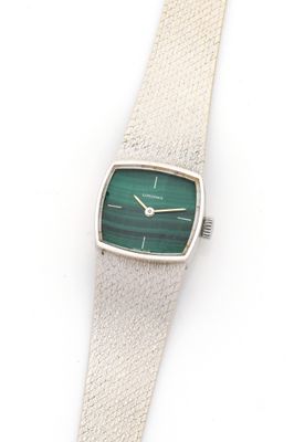 an image of a silver watch with a green face on a white background