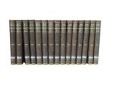 the books are lined up in a row on a white surface