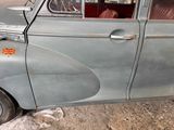 an old car with a british flag on the side of it