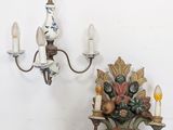 a candle holder and a chandelier sitting on a table
