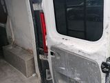 a white van with the door open on the side of the road