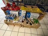 many different types of tools on a pallet in a store