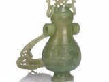 a green vase with a crown on top of it