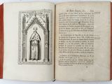 an open book with a drawing of a man in a robe