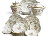 many plates and bowls that are sitting on a table