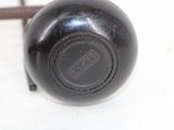 an image of a black vase on a white table