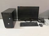 a desktop computer sitting on a desk next to a keyboard and mouse