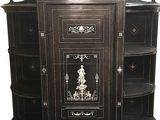 a black cabinet with a mirror on top of it