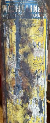 a metal can with a yellow and black label on it