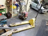 two pallets that are sitting on the floor in a garage