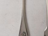 a fork and a spoon sitting on a table