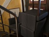 a chair that is sitting on the stairs in the room