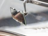 a close up of a mirror on a car ' s side mirror
