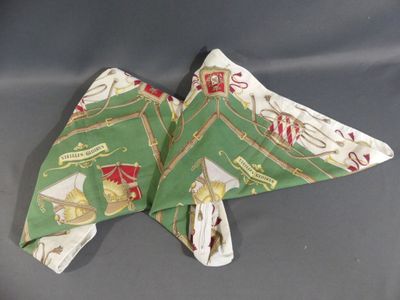 two folded napkins that are sitting on a table