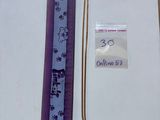 a picture of a book with a purple ribbon and a tag on it