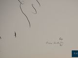 drawing of a person ' s hand with a pen and ink on a piece of paper