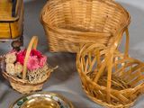 a table with a basket, cups and saucers on it