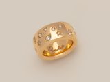 a yellow gold ring with diamonds and stars