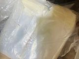 a plastic container with a piece of cheese in it