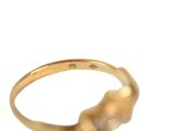 an image of a close up of a gold ring on a white background