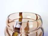 a close up of a glass vase on a table