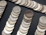 a lot of coins that are on a table