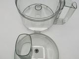 a glass bowl with a handle and a glass bowl with a lid