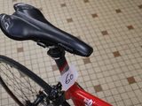a red bike with a black seat and a black saddle