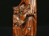 an image of a statue of a woman holding a child