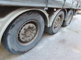 a close up of a truck tire on the road