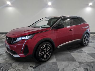 a red suv parked in a garage with a checkered floor