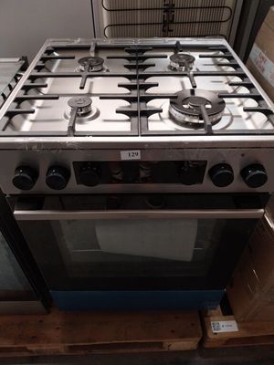 a stove that is sitting on a pallet in a room