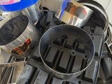 several pots and pans are stacked on top of each other
