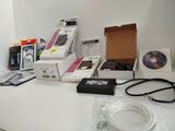 a lot of electronic equipment on a table in a room