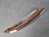 a small knife that is laying on a table