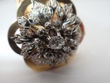 a close up of a ring with a flower design on it